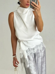 Elegant white satin high neck sleeveless top with lace trim and asymmetrical hem design