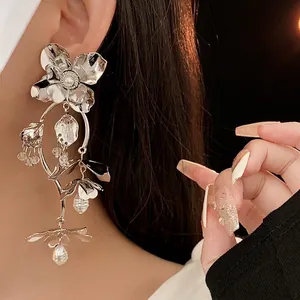 Exquisite silver flower earrings with pearls and beads shown on model for elegant style