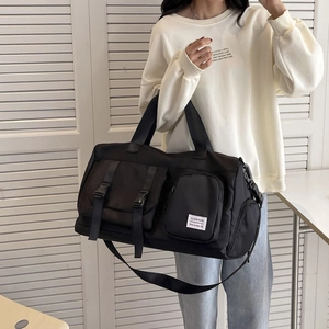 Large capacity black sports fitness bag with shoulder strap and multiple pockets