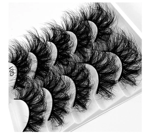 Macro shot of 5 pairs thick messy curled false eyelashes G01 on a white tray
