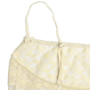 Close-up of yellow floral lace dress with adjustable spaghetti straps and mesh texture