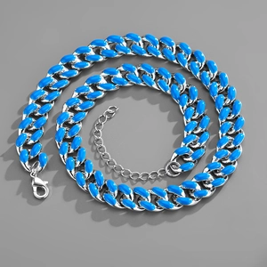Detailed view of silver Cuban link necklace with blue enamel and lobster clasp