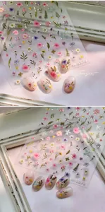 Detail of 3D floral embossed nail art sticker M-1072 with gold outlines and daisy patterns