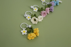 Colorful handmade crochet lily of the valley keychains with metal rings and bells