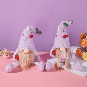 Plush purple Christmas gnomes set with lavender hats, bells, and mini gift boxes decoration