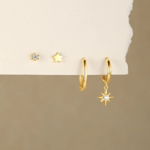 Detailed view of 4-piece gold S925 silver earring set with star and zircon studs