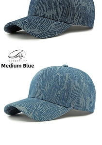 Detail view of medium blue denim baseball cap showing premium woven diagonal texture