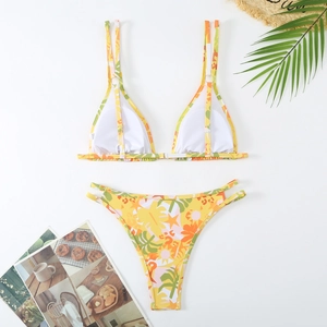 Close-up of tropical palm leaf print bikini with adjustable straps and high-cut side detail