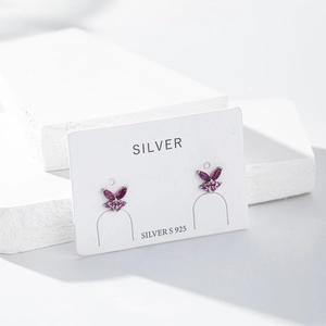 Detailed view of S925 sterling silver butterfly stud earrings with pink zircon stones