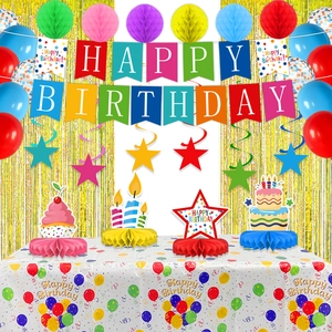 Detailed view of happy birthday party set with banners, paper honeycombs and gold foil fringe