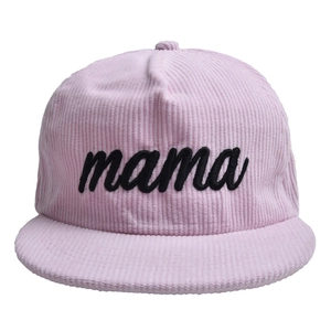 Close-up of pink corduroy baseball cap with black embroidered mama script text