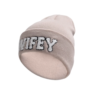 Detailed close-up of WIFEY plush embroidery on a beige knitted beanie hat