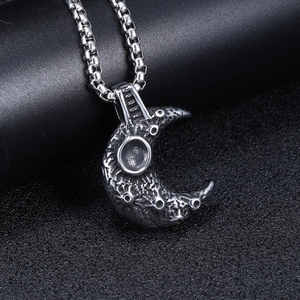 Retro stainless steel moon crater pendant necklace with textured silver crescent moon design