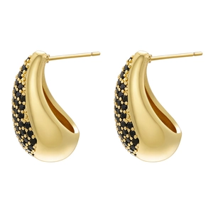 Detailed close-up of teardrop stud earrings with gold plating and micro-pave black stones