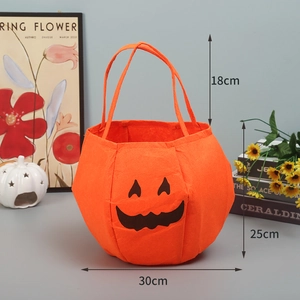 Detail showing dimensions of 30x25cm for the orange embroidered pumpkin candy bag