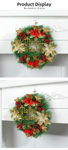 Detail of Christmas wreath with pine needles, red berries, and gold Merry Christmas sign