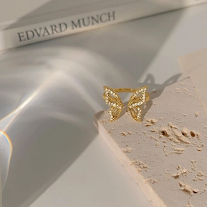 Exquisite 18K gold butterfly open ring with sparkling white cubic zirconia on beige stone