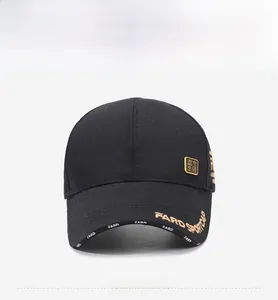 Detail of gold letter embroidery and mesh fabric on a black sport baseball cap