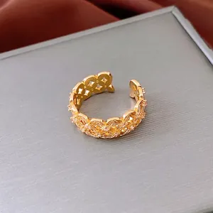 18k gold plated open ring featuring hollow geometric texture and white zircon accents
