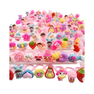 Colorful resin cartoon children's rings set displayed on white stand for girls