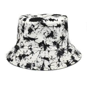 Detailed close-up of the black and white tie-dye pattern on a cotton bucket hat
