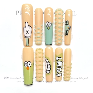 Extra long handcrafted KAWS style fake nails with 3D cartoon art and green accents