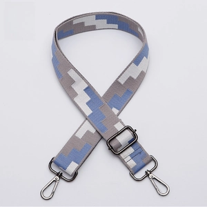 Detail of adjustable geometric weave strap with gunmetal lobster clasps for bags