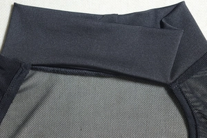 Detail of high collar neckline with sheer black mesh stitching on sexy bodycon dress