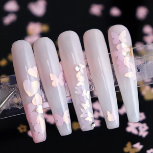 Pink and gold butterfly heart nail sequins on milky white press-on nails with rhinestones