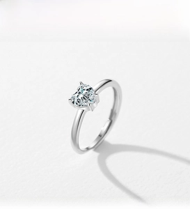 Close-up of heart-cut cubic zirconia on S925 sterling silver open ring with three-prong setting