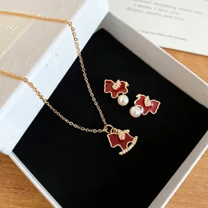 Elegant gold plated horse jewelry set with red enamel, zircons and white pearls