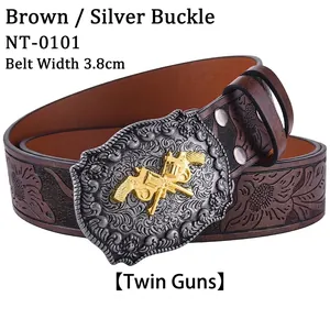 Detail of western leather belt with floral embossing and gold dual gun buckle