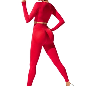 Red high-waist yoga set with long sleeve crop top and lifting leggings in back view