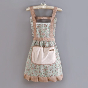 Floral kitchen apron detail with polka dot trim and lace ruffles on padded hanger