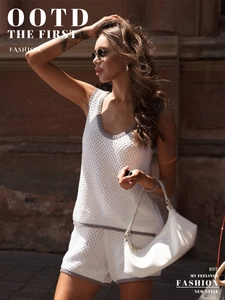 Close-up of white knitted U-neck tank top and shorts set with gray contrast borders