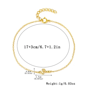 Macro detail of gold snake pendant necklace with zircon inlay and 17+3cm chain length
