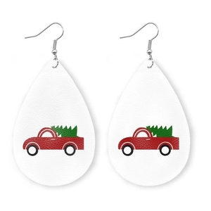 Faux leather teardrop earrings featuring a red truck and green Christmas tree pattern