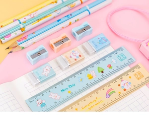 Close-up of 5-in-1 stationery set with 15cm ruler, eraser, sharpener, and pencils