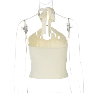 Detail of cross-back tie-neck top in cream white with lace-up back design