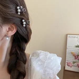 Elegant pearl hair clip set and planet-shaped earrings on model for a trendy Korean look