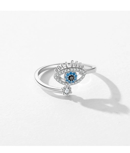 Macro shot of S925 silver Evil Eye ring featuring blue stones and a star pendant