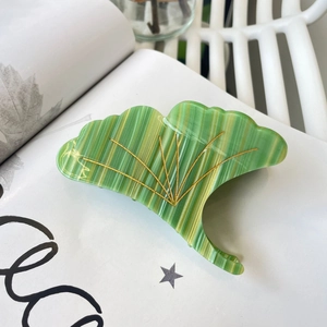 Ginkgo leaf hair claw clip made of green acetate with gold striped details