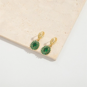 Elegant gold earrings featuring a green oval gem with flower-shaped micro-pave crystals