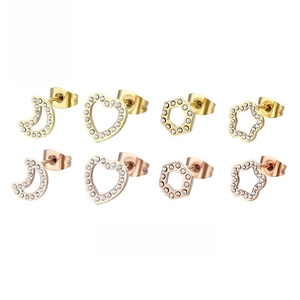 Detail of star, heart, and flower earrings with crystal inlay in gold and rose gold