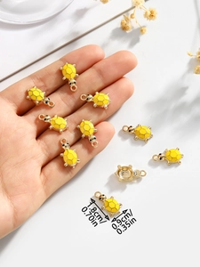 Detailed view of yellow turtle pendant charm with dimensions 1.8x0.9cm for DIY jewelry