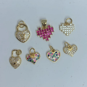 Set of seven golden heart-shaped pendants featuring colorful zircon crystals for jewelry DIY