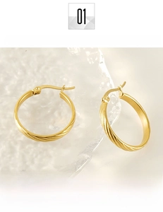 Detailed view of 18K gold plated stainless steel earrings with textured diagonal stripes