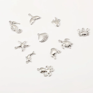 Detailed silver stainless steel ocean charms featuring seahorse, starfish, and shell shapes