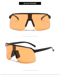 Detail view of lightweight black and orange cycling sunglasses with semi-rimless frame