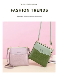 Close-up of mini crocodile pattern crossbody bag with metal clasp and leather strap
